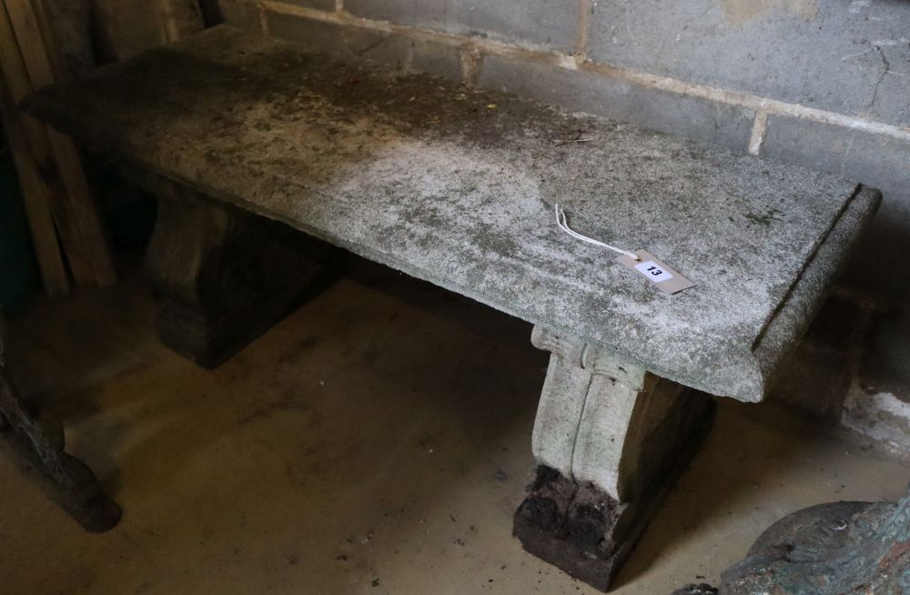 A reconstituted stone garden bench seat, width 106cm